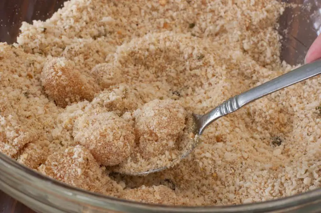 Chicken nuggets in breading mixture