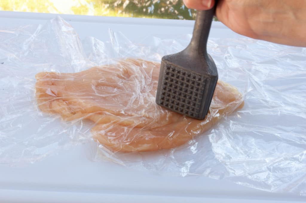 Flatten chicken with meat mallet