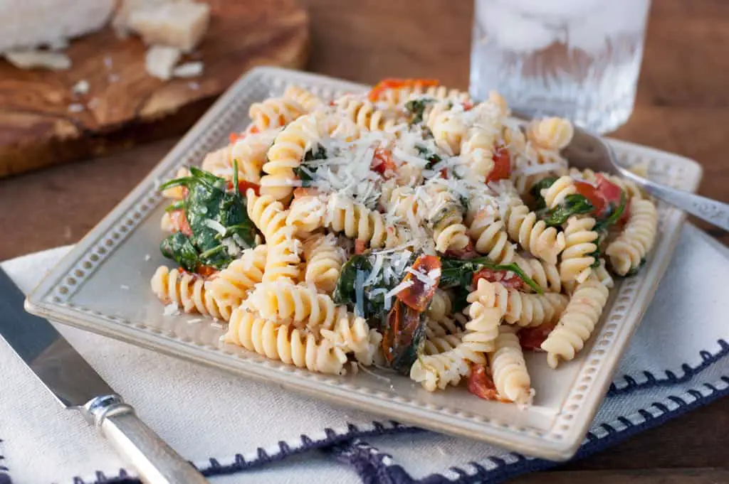 Fusilli Pasta with spinach, Asiago cheese, and cherry tomatoes - The Kitchen Snob