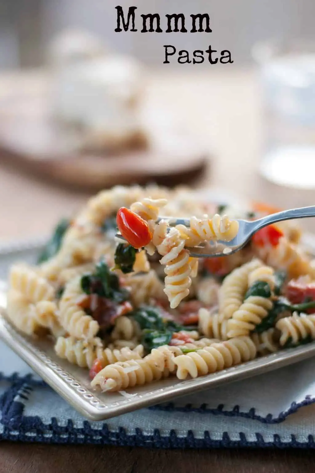 Fusilli pasta with spinach, Asiago cheese, and cherry tomatoes - www.thekitchensnob.com