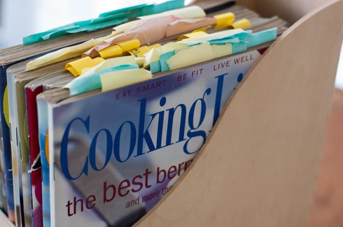 side view of wood magazine holder with frayed old Cooking Light magazines