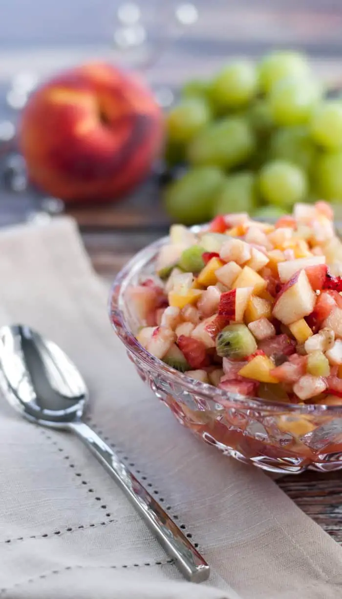 This fruit salad is chopped in small pieces for that perfect bite of fruit flavor! #vegetarian #sides #recipes