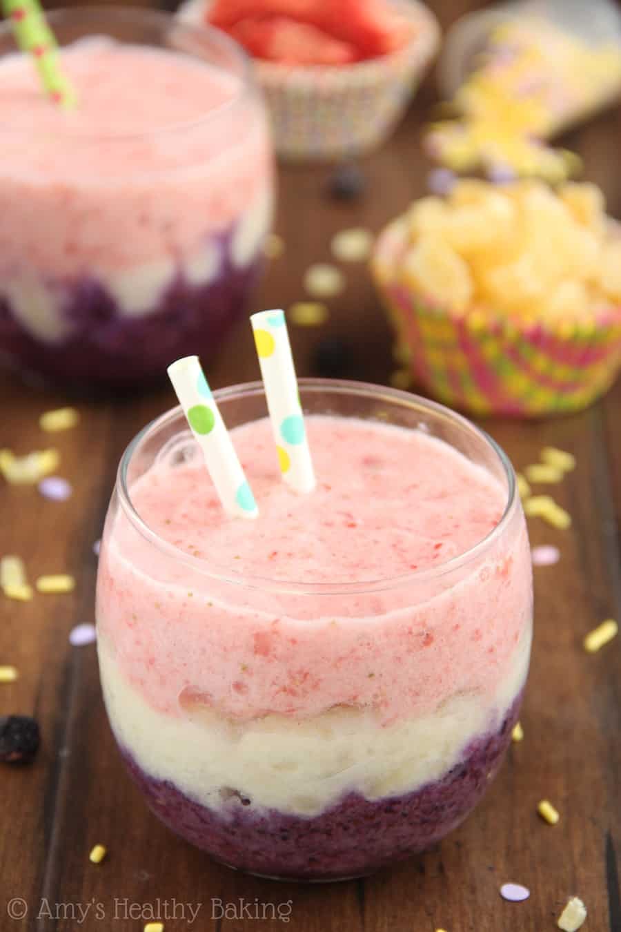 Cute little clear glass filled with 3 layers of smoothy flavors: dark purple, white, and pink with 2 polka dotted straws