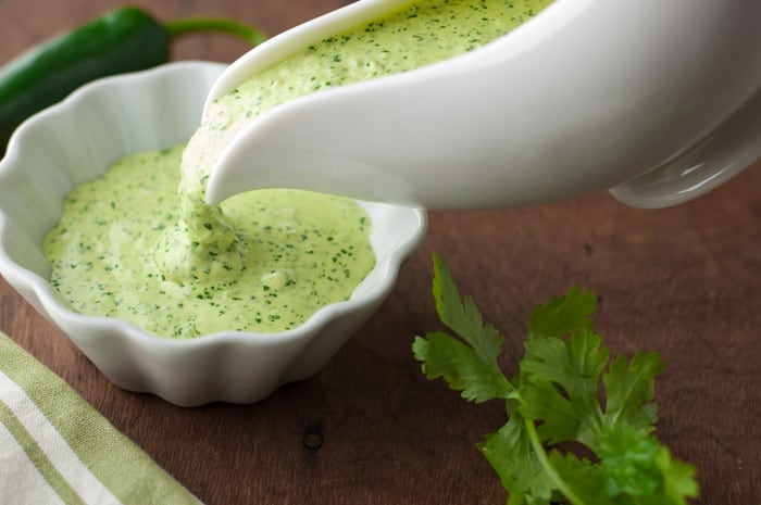 Peruvian Green Sauce aka Aji Amarillo sauce or Aji Verde sauce - this has a serious kick! Made with jalapenos, cilantro, aji pepper sauce & lime