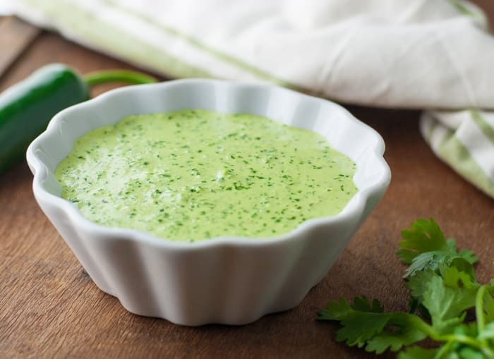 Peruvian Green Sauce aka Aji Amarillo sauce or Aji Verde sauce - this has a serious kick! Made with jalapenos, cilantro, aji pepper sauce & lime