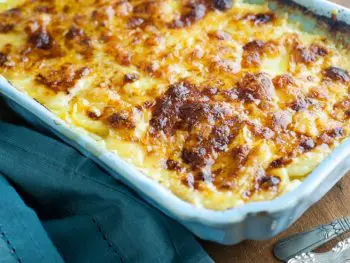 Cheesy Scalloped Potatoes Au Gratin with Gruyere and Fontina - has a hint of garlic and Parmesan cheese. The BEST casserole for a great side dish!
