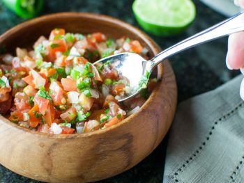 Pico de Gallo (Salsa Fresca) recipe is a perfect topping to many dishes. Make it mild or spicy!