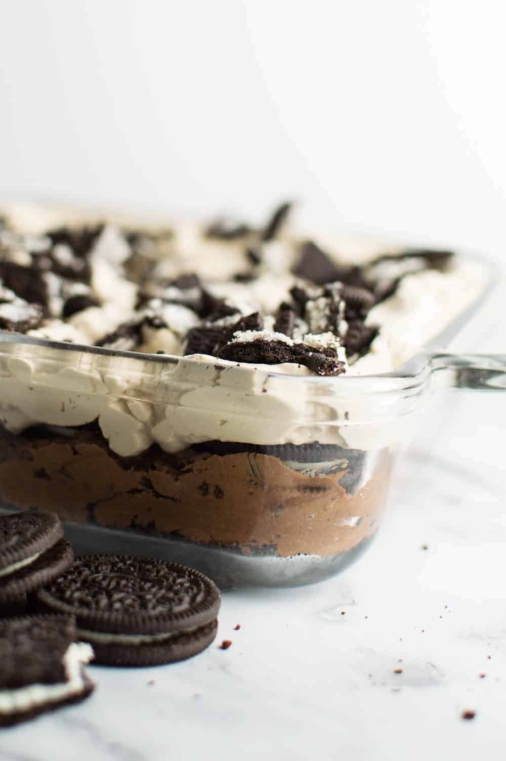 Clear casserole dish showing layers of Oreo dessert