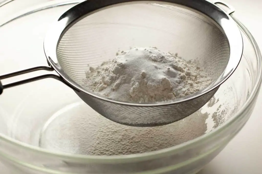 Dry ingredients before they are sifted into a large clear bowl