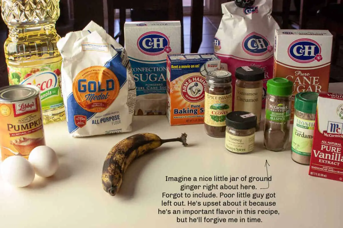 Ingredients to make pumpkin banana bread on a white table