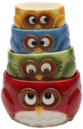 4 ceramic measuring cups stacked up that look like owls