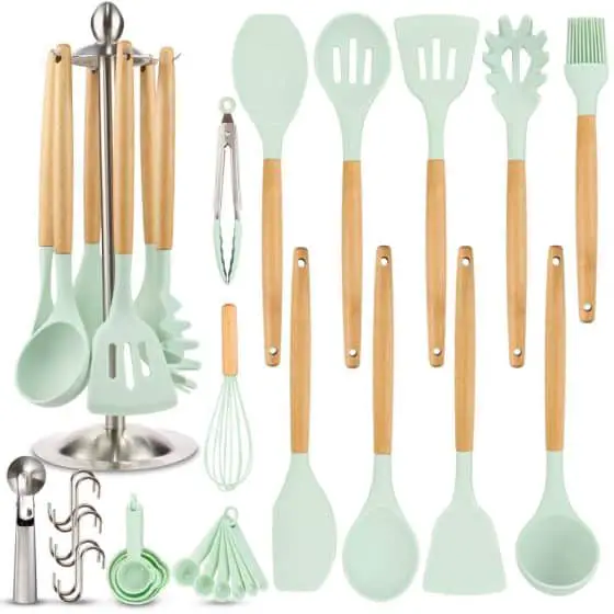 Set of mint green silicone cooking utensils with light wooden handles