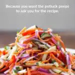 Side view of a piled high salad with strips of zucchini, red bell peppers, red onions, and carrots