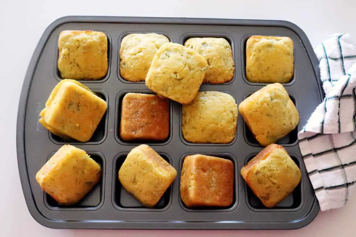 Pan of chili cornbread just out of the oven baked into little squares